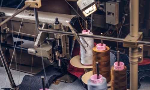 Picture of a tailor's desktop at a sewing workshop.